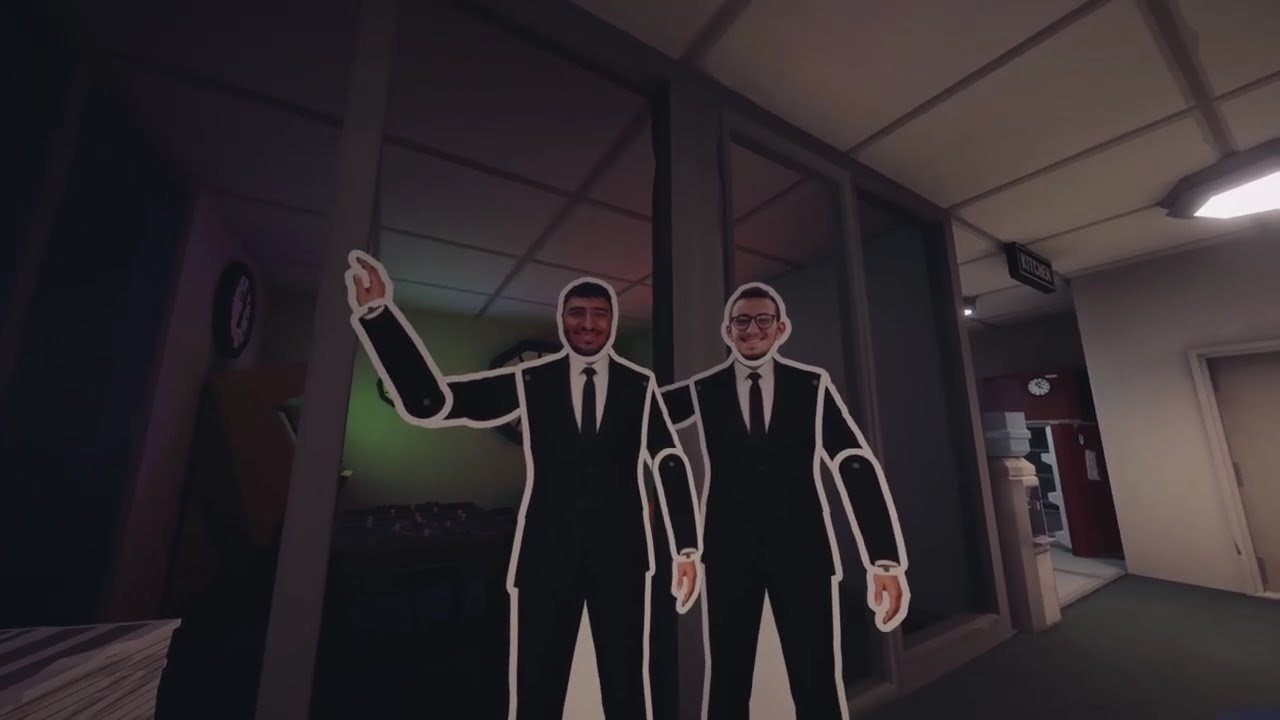 Still from the Good Morning, {Employee Name} trailer showing the office interior.